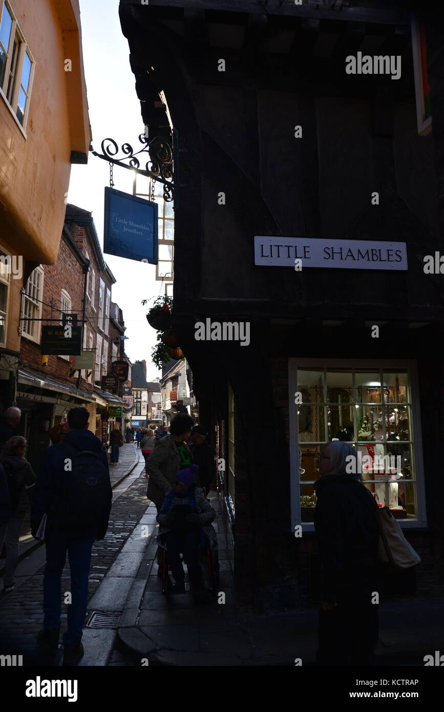 Narrow cobblestone street of shops, York, UK Stock Photo