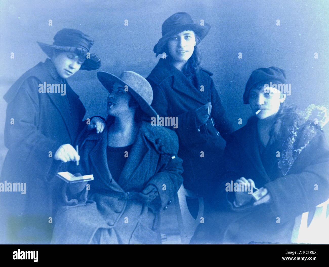 Large negative of young women smoking, probably taken in the 1920s, and inverted to a positive in Photoshop:  Fotomuuseum, Raekoja, Tallinn, Estonia Stock Photo