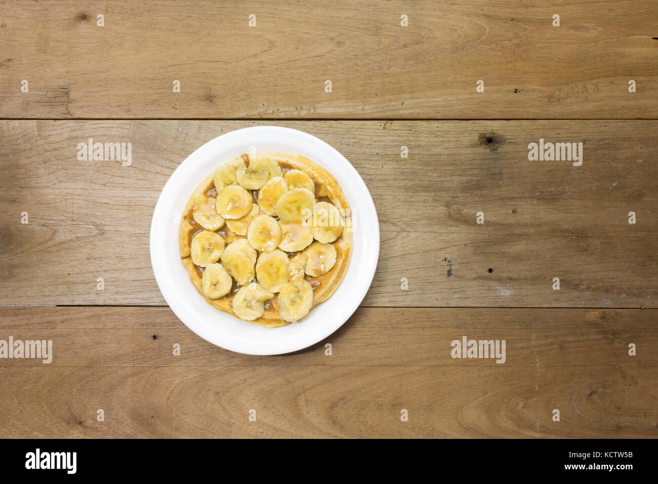 Waffle with milk caramel spread (Spanish Dulce de leche) and banana