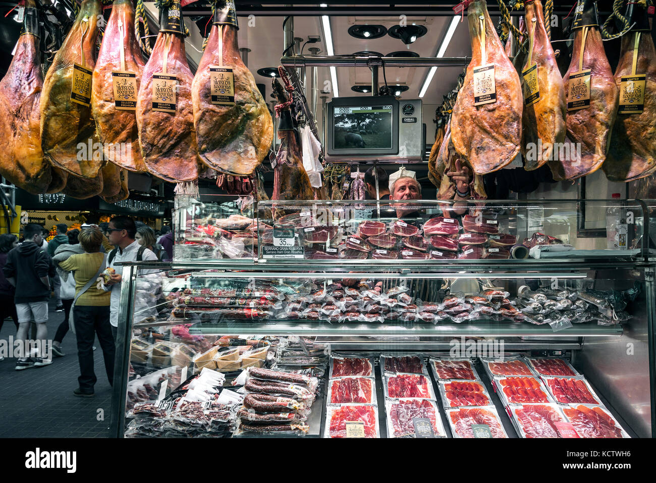 traditional cured meat and sausage shop in la boqueria market of