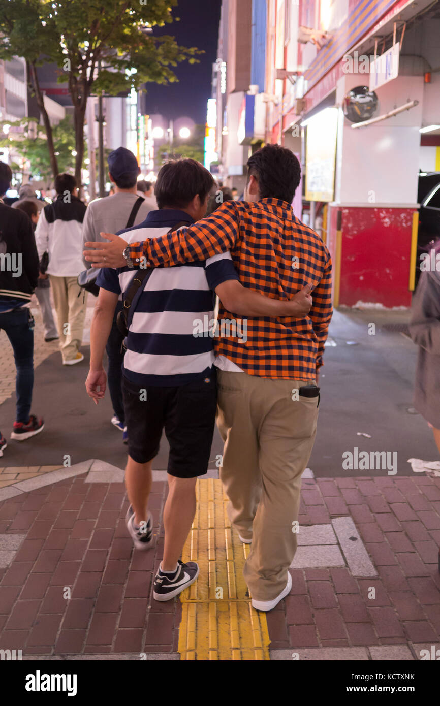Two Middle Aged Male Friends Walking Arm In Arm Down Susukino Sidewalk At Night After Drinking Supporting Each Other As They Walk To The Next Bar Stock Photo Alamy Two Middle Aged Male Friends Walking Arm In Arm Down Susukino Sidewalk At Night After Drinking Supporting Each Other As They Walk To The Next Bar Stock Photo Alamy