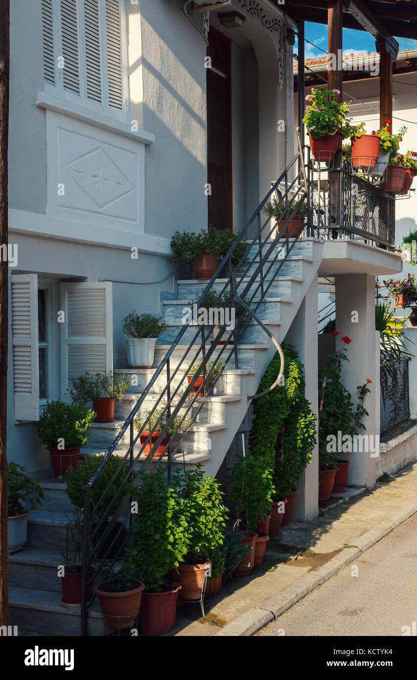 Flower decor of a Greek hose, view from street, there are no sidewalks here  Stock Photo - Alamy