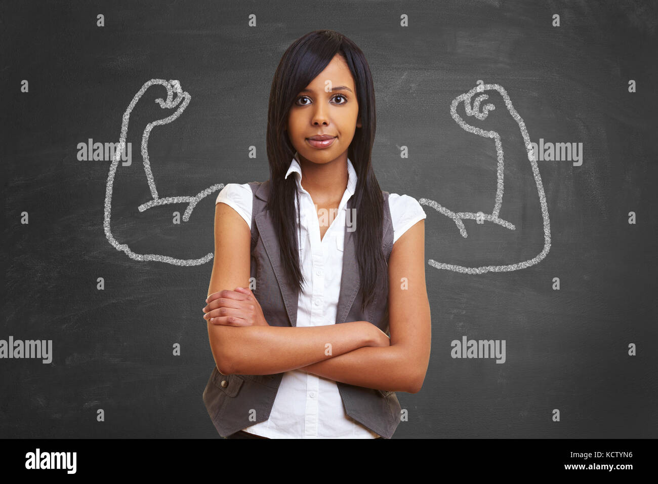 Strong and powerful woman with self confidence and chalk muscles Stock Photo