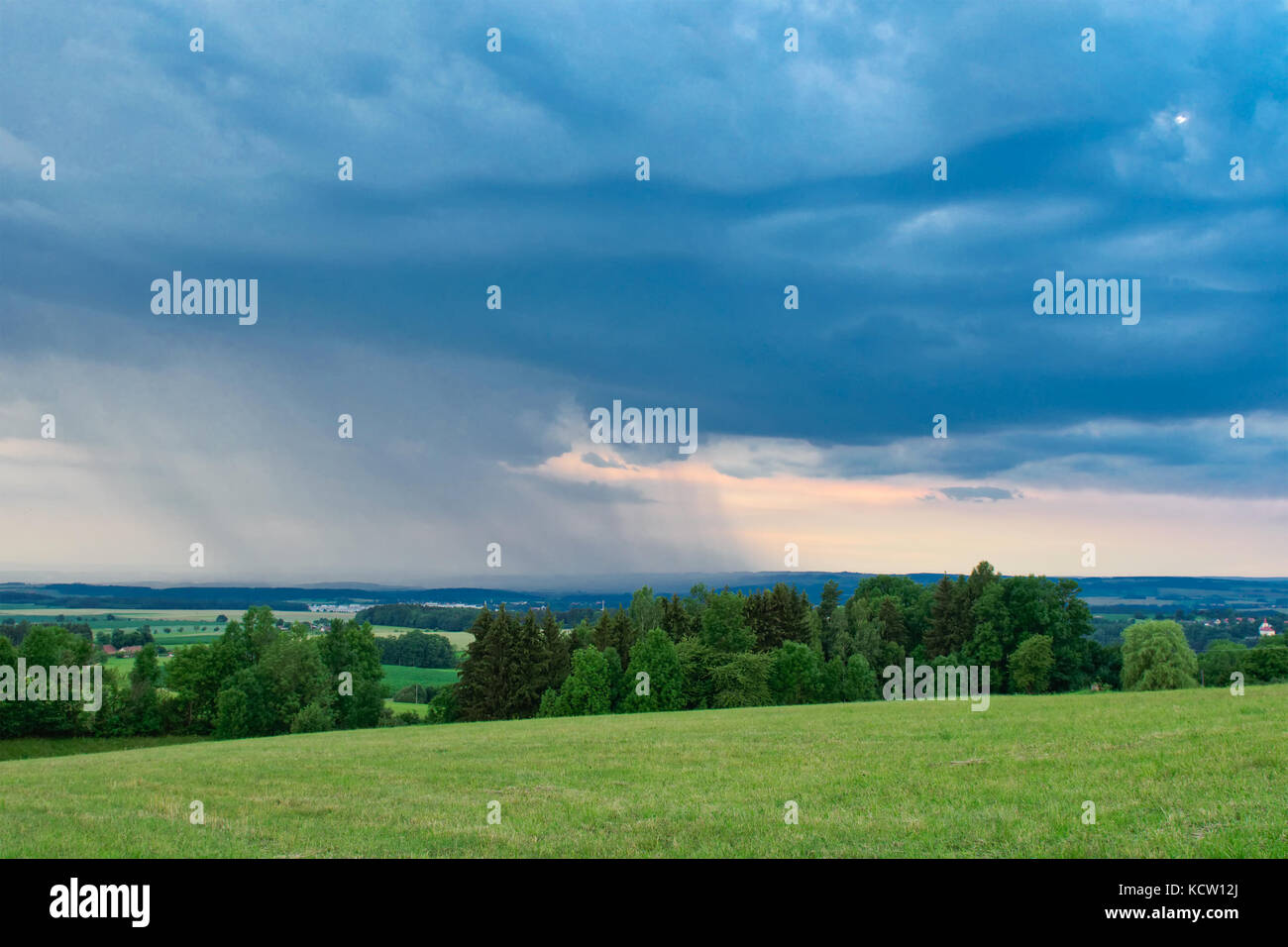 Beautiful storm clouds over summer land Stock Photo - Alamy