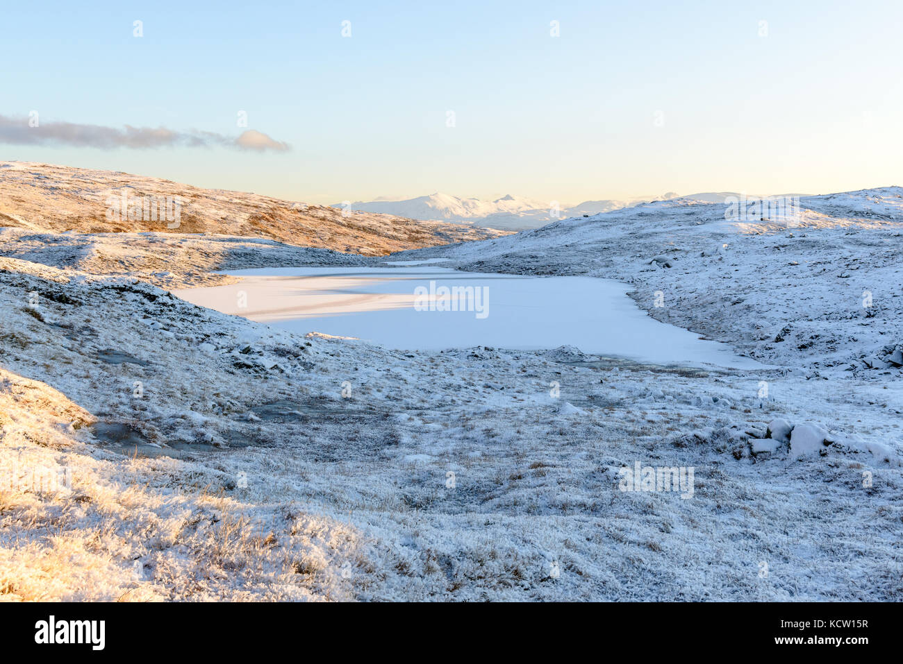 Picture is taken on a hike up Kjølen (mountain). Landscape with lake  in soft winter light. Kvaløya, Tromsø, Norway. Stock Photo