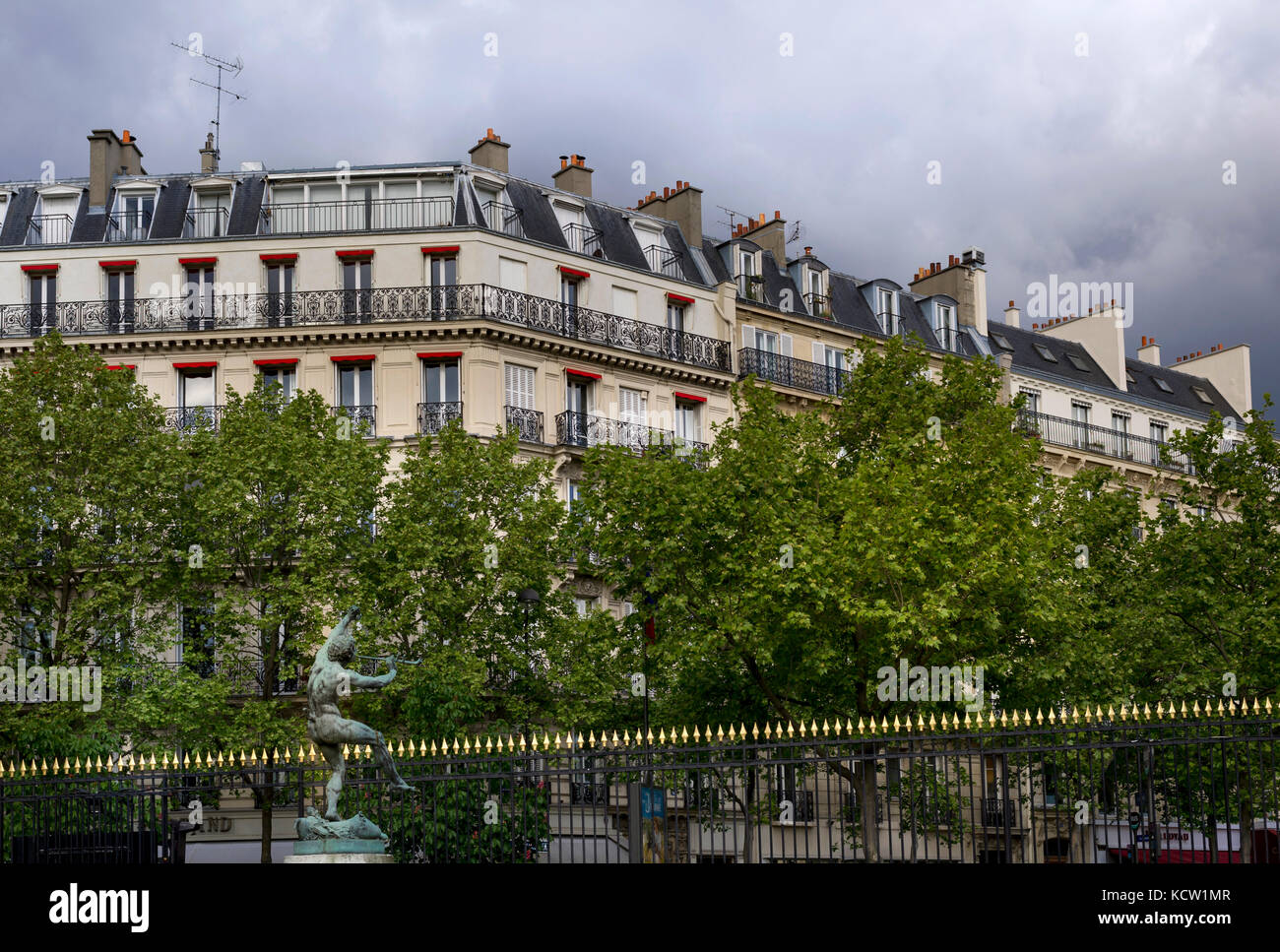 Luxembourg gardens fence and apartment buildings surrounding the park. Stock Photo