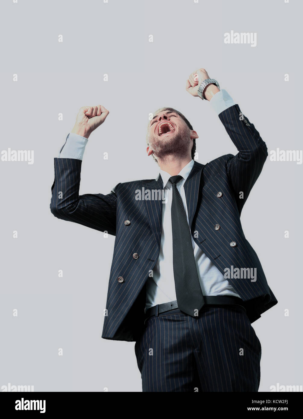 very happy energetic businessman with his arms raised Stock Photo - Alamy
