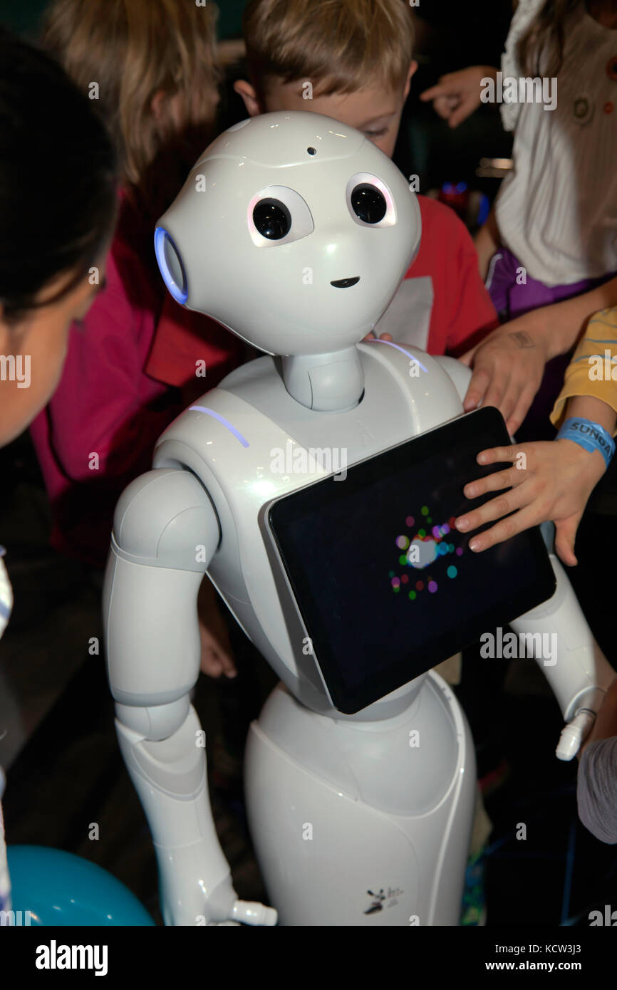 Children interacting with Pepper, a humanoid social robot, in the Robot  Zone at New Scientist Live 2017 Stock Photo - Alamy