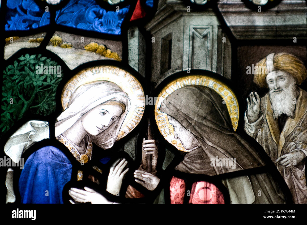 Two woman saints in stained glass St John's Church Glastonbury Stock Photo