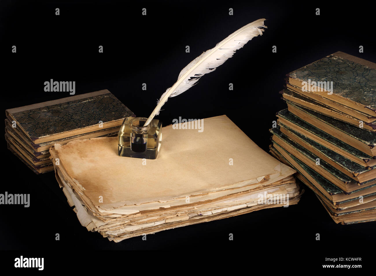 Vintage background with old ink bottle, books, papers and quill Stock ...