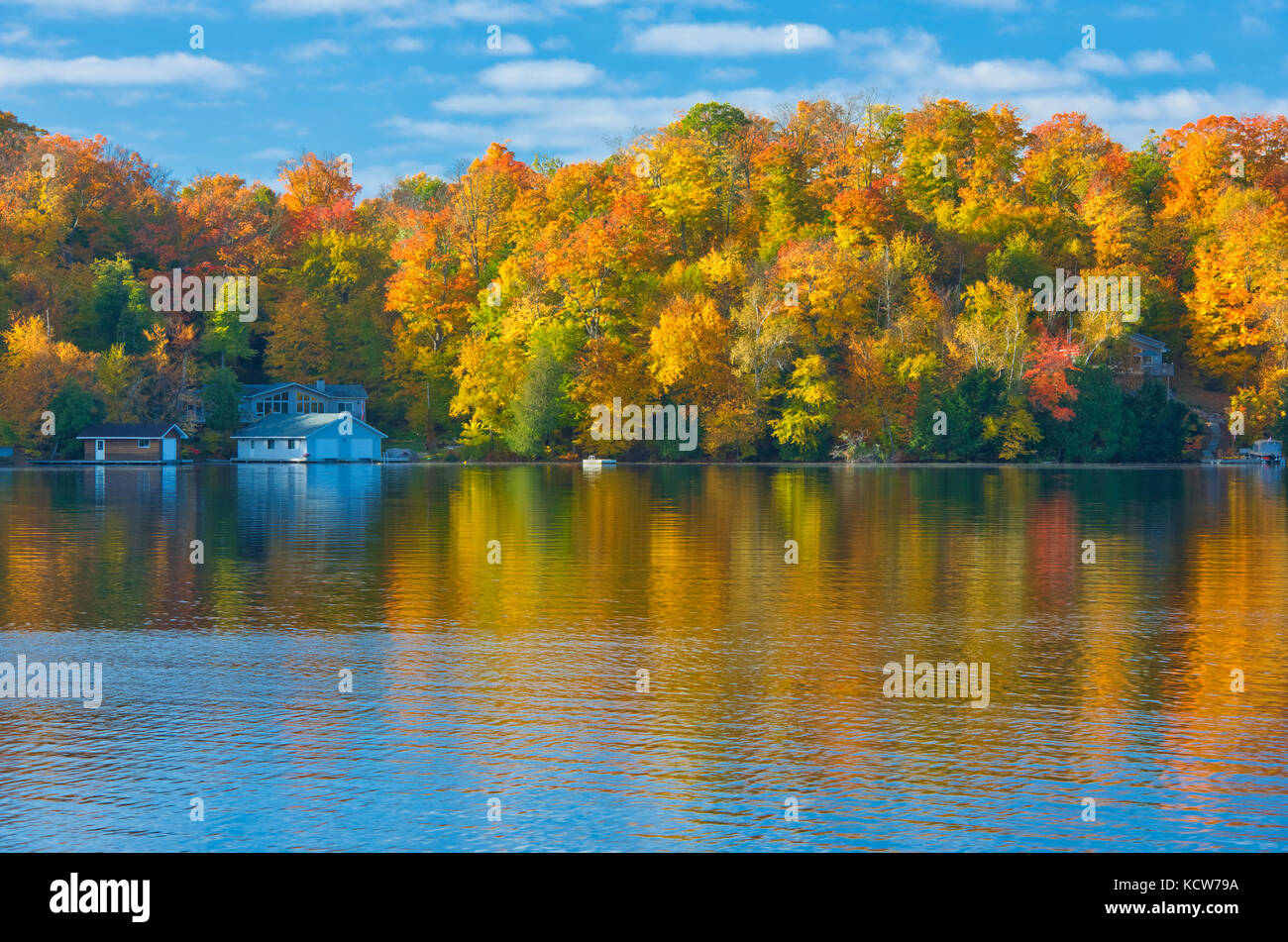 Horseshoe Lake in autumn with cottage , Near Parry Sound, Ontario