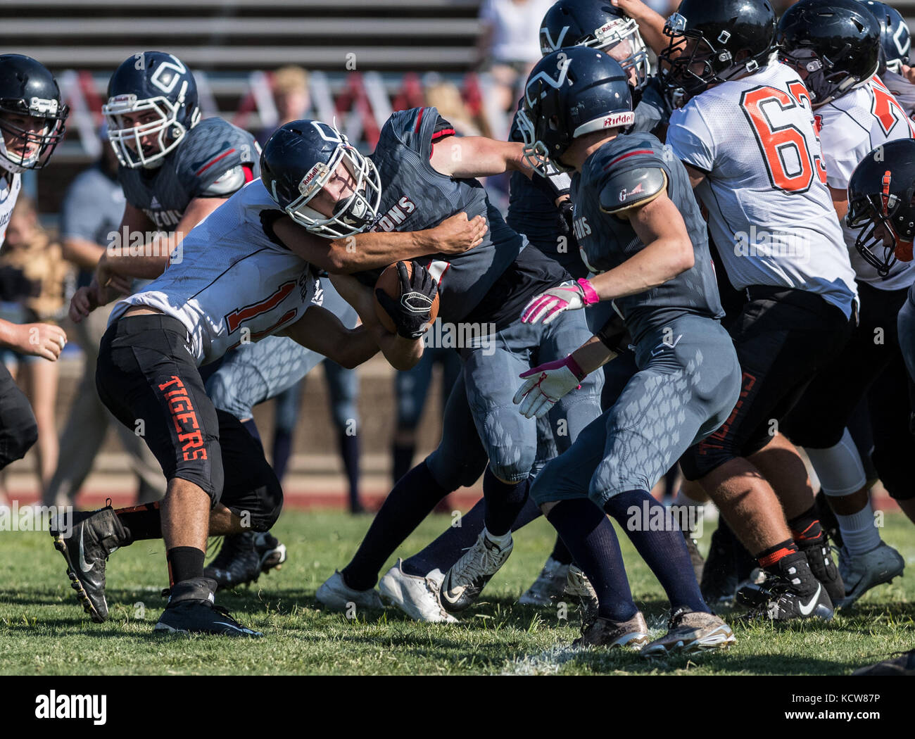Football action with Arcata vs. Central Valley High School in  City of Shasta Lake, California. Stock Photo