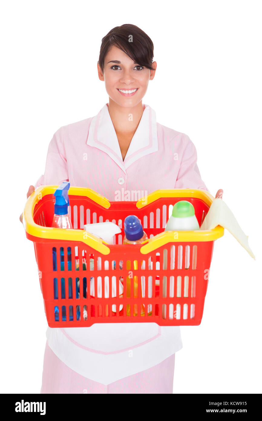 Happy Female Cleaner Holding Bucket With Cleaning Supplies Over White Background Stock Photo