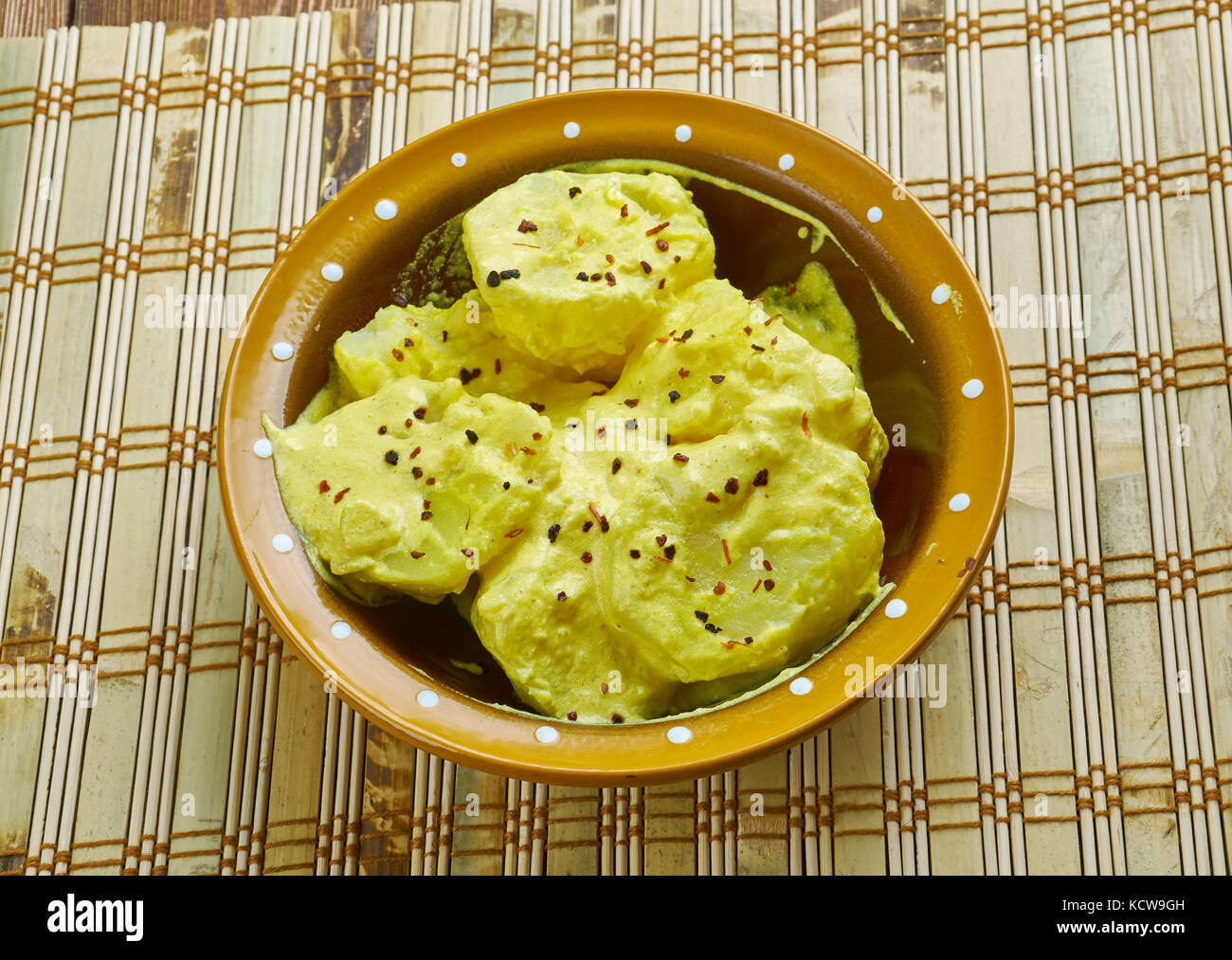 Kashmiri dum aloo baby potatoes in a spicy vibrant curd based gravy Stock Photo Alamy