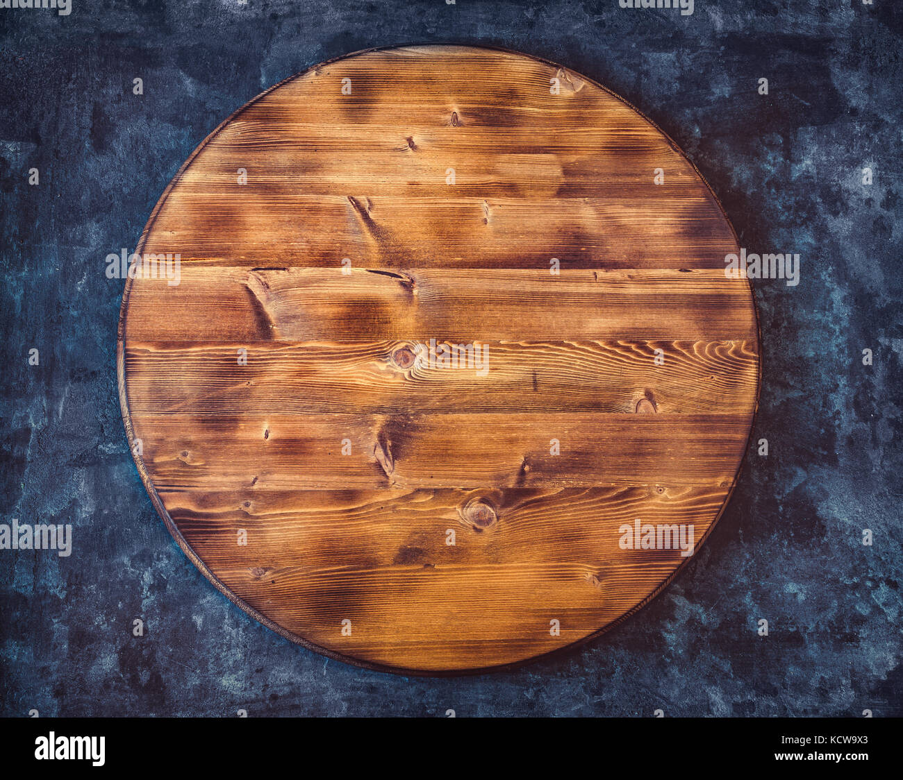 Cutting Board On Dark Wood Background Top View Stock Photo