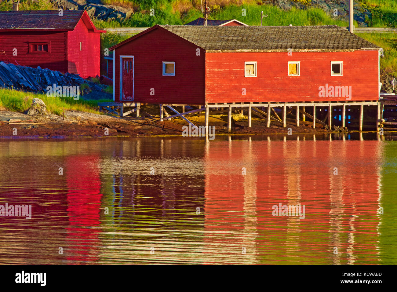 Reflection of village in in Bonavista Bay, Salvage, Newfoundland & Labrador, Canada Stock Photo