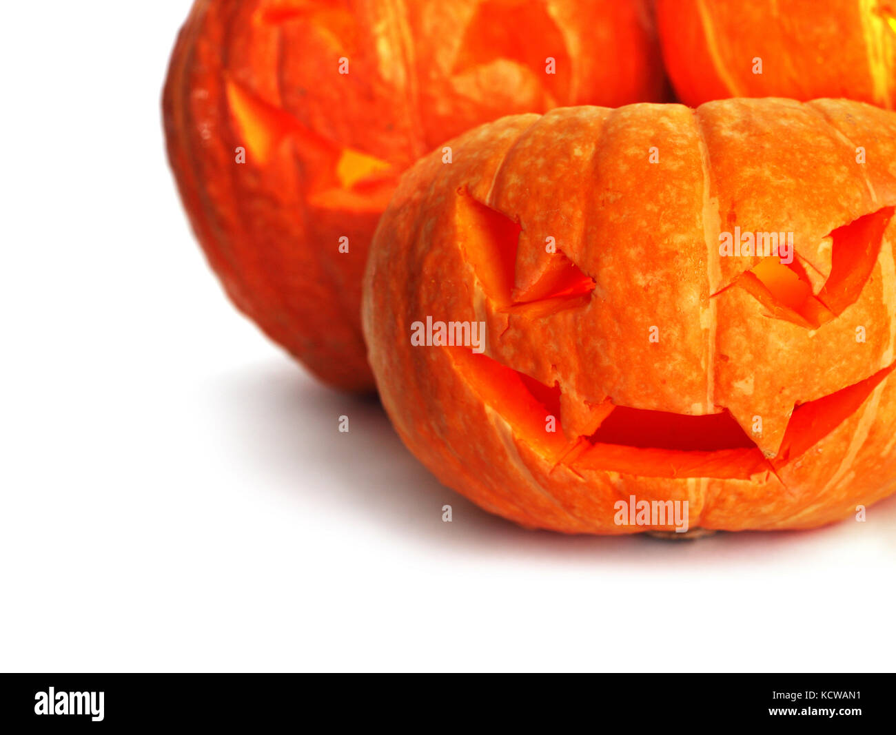 Three cute halloween pumpkins isolated on white background Stock Photo ...