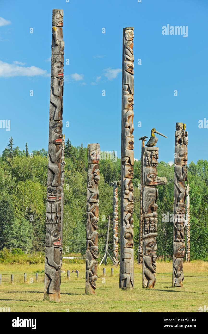 Kitwanga Totem Poles. Gitwangak or Gitwangax. Gitanyow. Gitksan people. Northwest Coast First Nations. Nass Range of mountains , Kitwanga, British Columbia, Canada Stock Photo