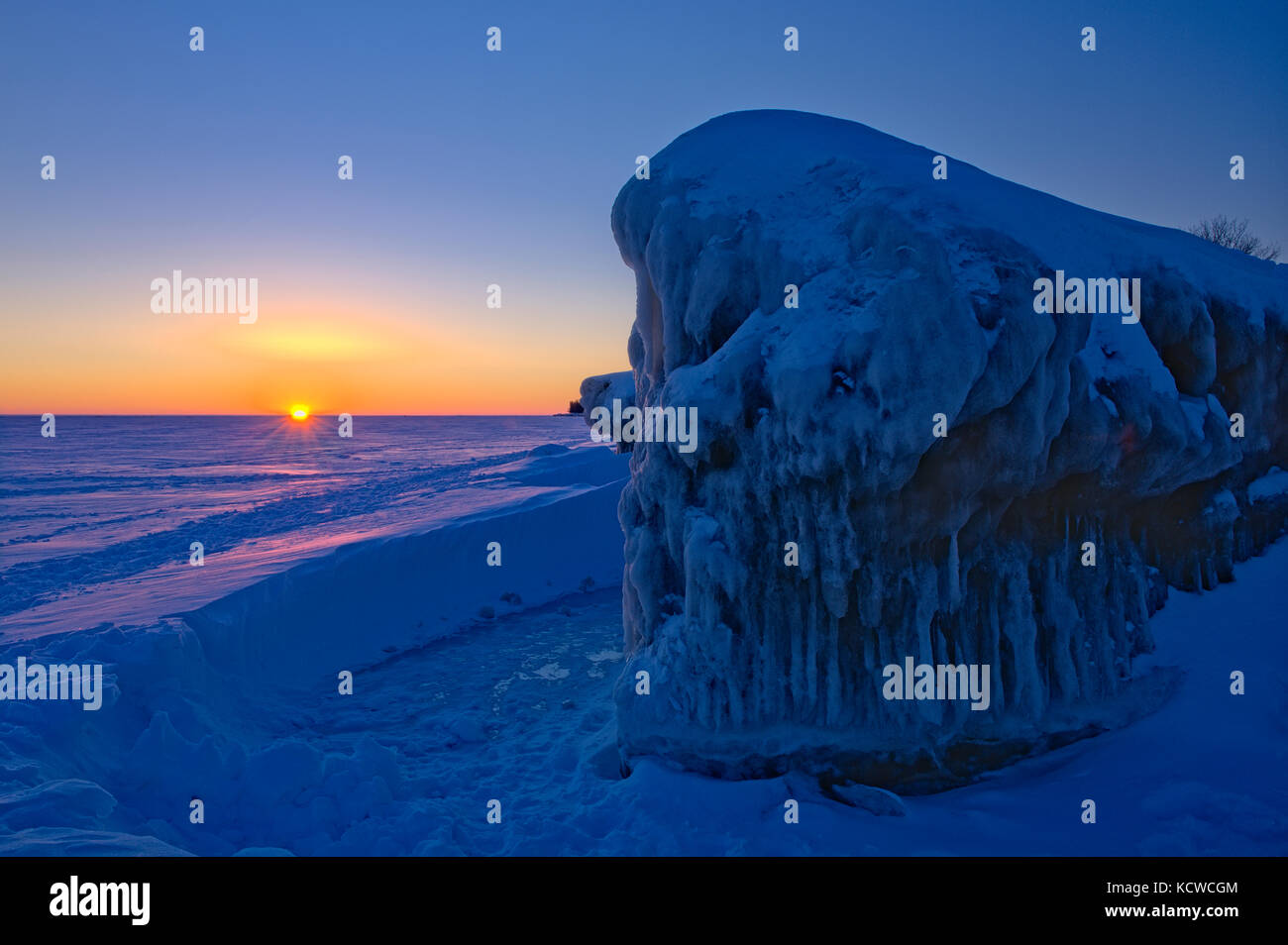 Ice on shore of Lake Winnipeg at sunrise, Winnipeg Beach, Manitoba, Canada Stock Photo