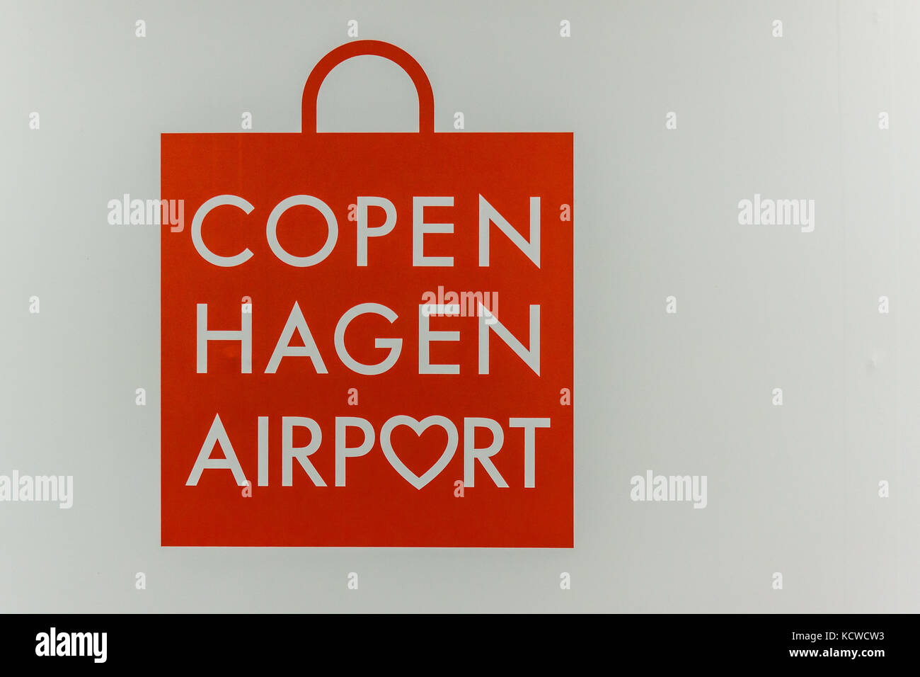 Red bag as a sybol for taxfree shopping in Copenhagen Airport, Denmark, September 13, 2017 Stock Photo