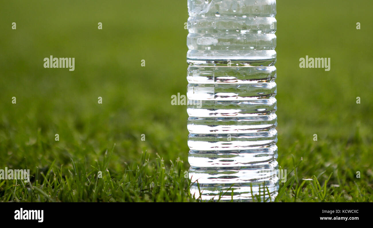 picture of a plastic water bottle on a green grass Stock Photo - Alamy