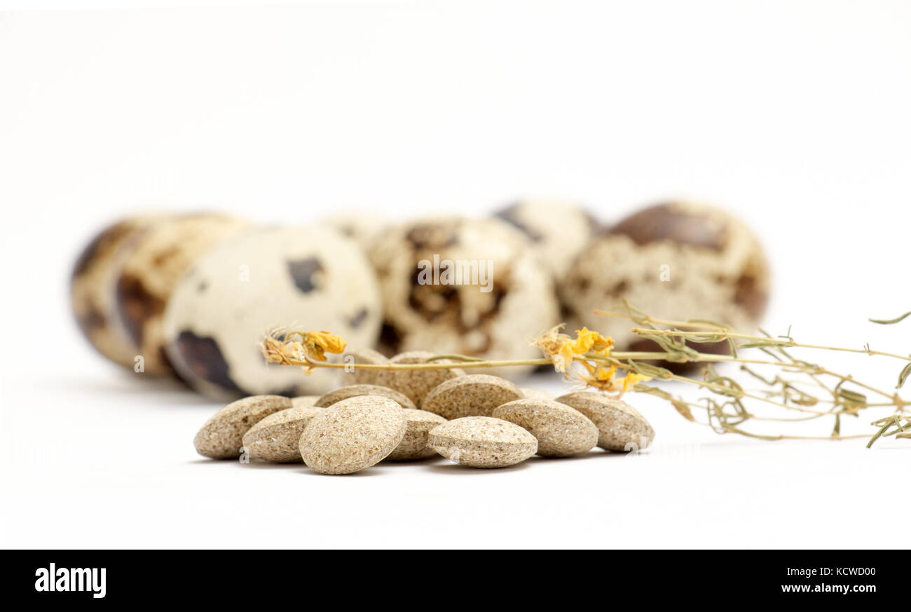 picture of a japanese quail eggs and herbal pills Stock Photo Alamy