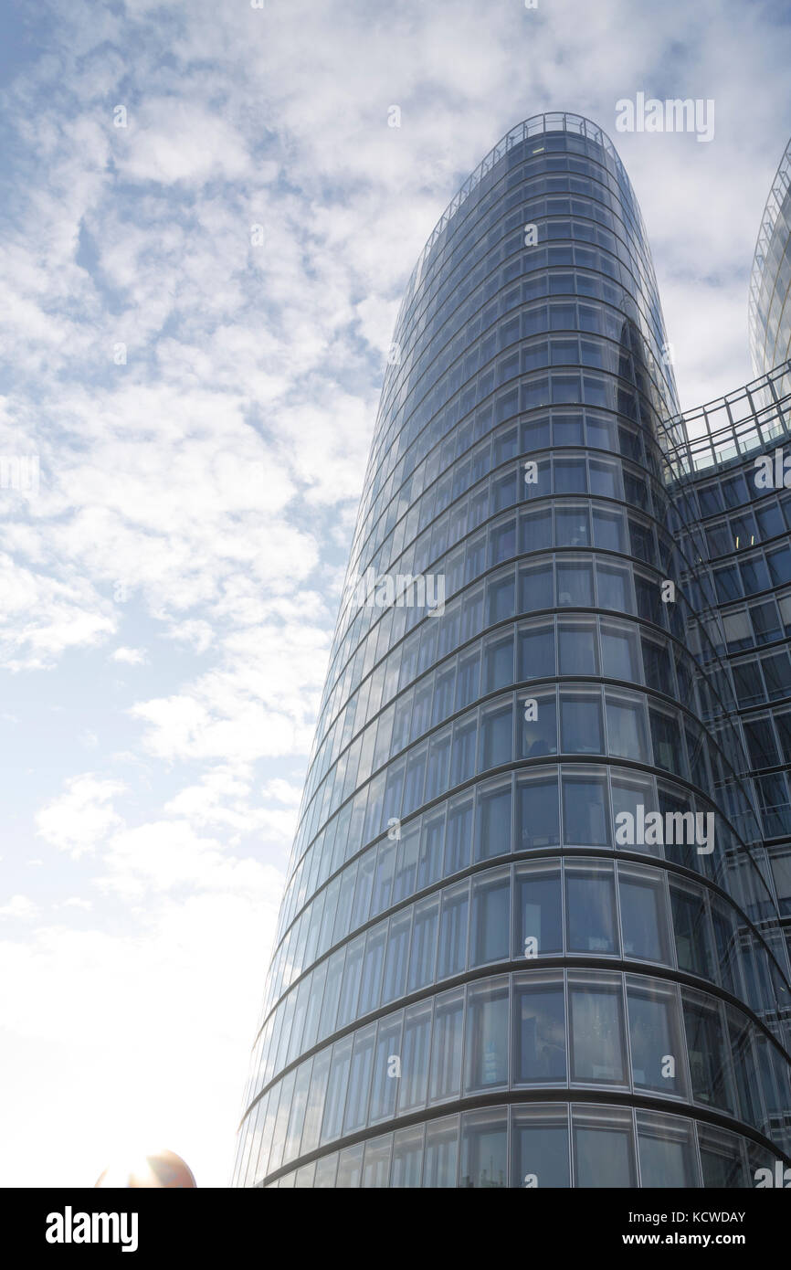 Glass modern building on a blue cloudy sky Stock Photo - Alamy