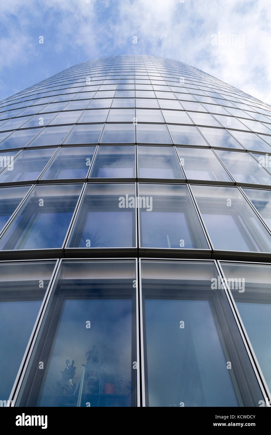 Glass modern building on a blue cloudy sky Stock Photo - Alamy