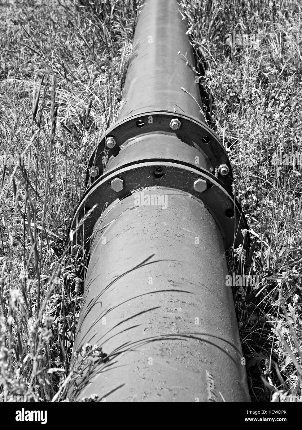 Repaired big drink water pipes joined with new blue flanges and silver