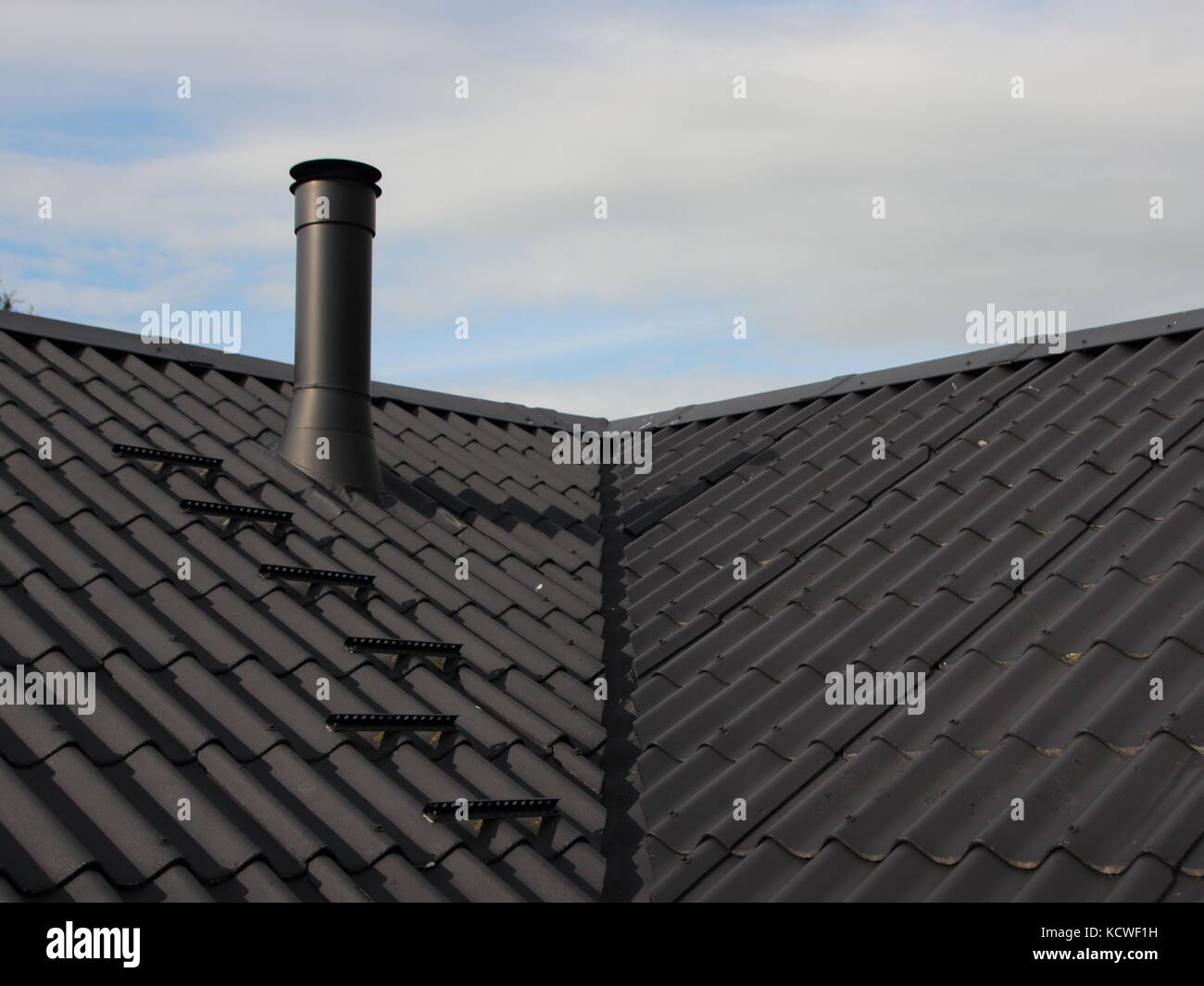 Black Metal Chimney on Roof with Secure Sweeper Steps Stock Photo Alamy