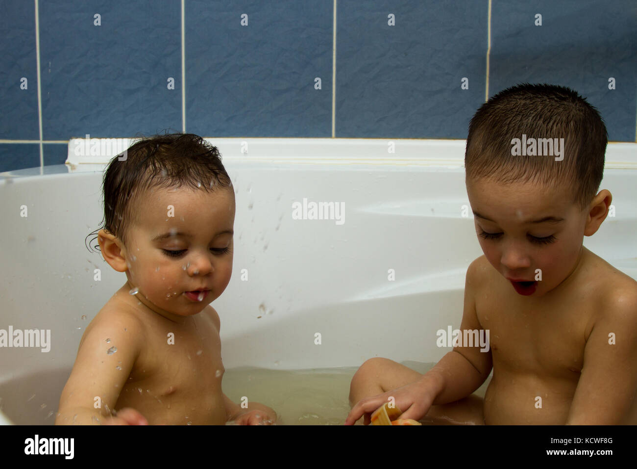 bath boys Two little boys having fun with water by taking bath in bathtub. bath Stock  Photo - Alamy