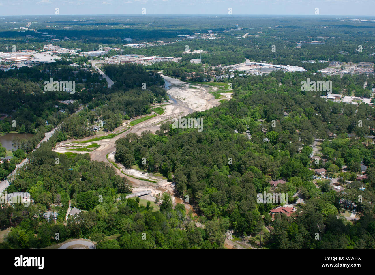 South Carolina Army National Guard UH-60 Black Hawk helicopter from the 1-111th General Support Aviation Battalion flies over areas hit by the flood in 2015, for a six-month survey on the reconstruction’s effort and progress, Columbia, SC, April 23, 2016. (U.S. Army National Guard Photo by Staff Sgt. Roby Di Giovine/Released) Stock Photo