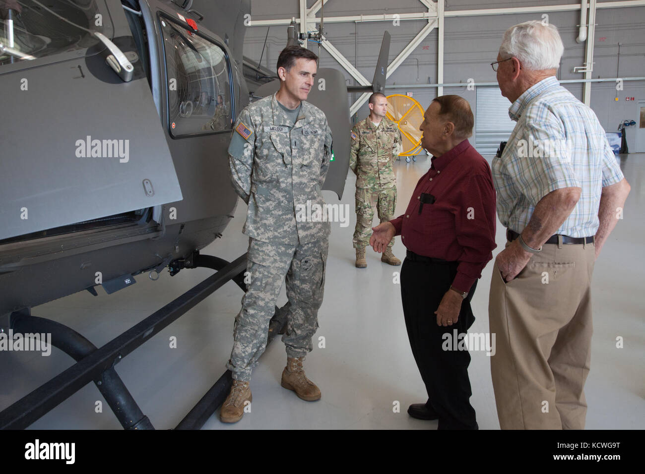 A group of World War II veterans with Honor Flight Upstate South Carolina visited the South Carolina National Guard’s Army Aviation Support Facility 2 in Greenville, S.C., June 22, 2016. The veterans were briefed on the aircraft and operations of the facility during the visit. (U.S. Army National Guard photo by Capt. Brian Hare/Released) Stock Photo