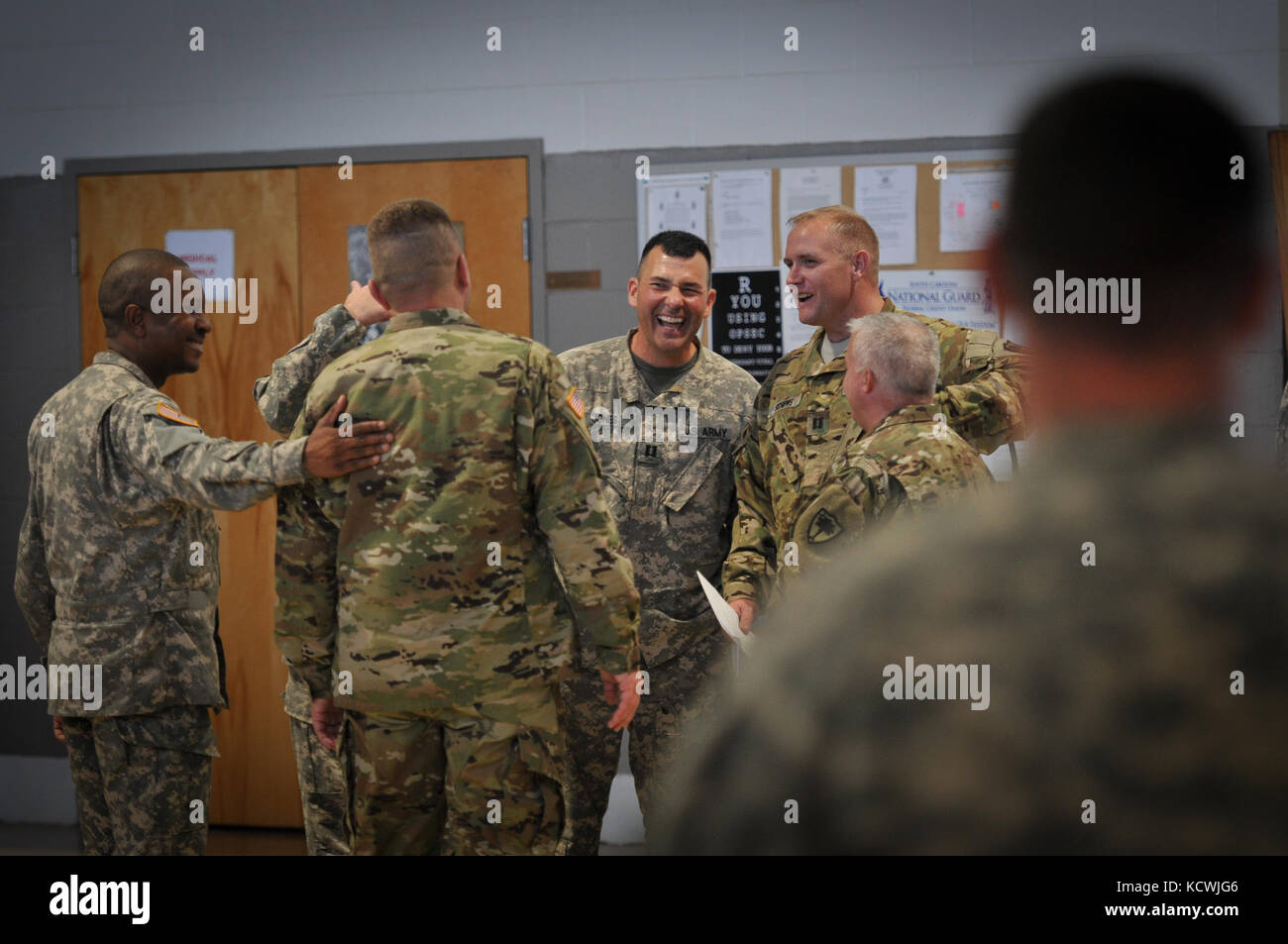 S.C. Army National Guard Soldiers with Headquarters and Headquarters Company (HHC), 2-151st Security and Support Aviation Battalion (SSAB), 59th Aviation Troop Command (ATC), participate in a change of command ceremony, Donaldson armory, Greenville, S.C., Nov. 4, 2016. During the ceremony, outgoing commander Cpt. Tres Bruner passed the company colors to the incoming commander, Cpt. Christopher Jones. The purpose of the change of command ceremony is to pass the command of the unit to the new commander, thus the passing of responsibility over equipment and personnel. The passing of the unit colo Stock Photo