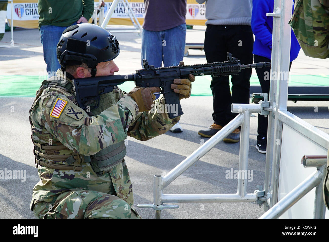 U.S. Army Maj. Gen. Robert E. Livingston, Jr., Adjutant General for South Carolina, competes in the “Battle Challenge” mobile obstacle course at McCrady Training Center in Eastover, South Carolina, Jan. 27, 2017. The Battle Challenge requires participants to perform nine tasks under pressure of time, including a cargo net climb, a knotted rope descent, wall surmount, ammunition resupply, low crawl, gas can carry, marksmanship tasks, and a service member-down rescue. (U.S. Army National Guard photo by Capt. Brian Hare) Stock Photo