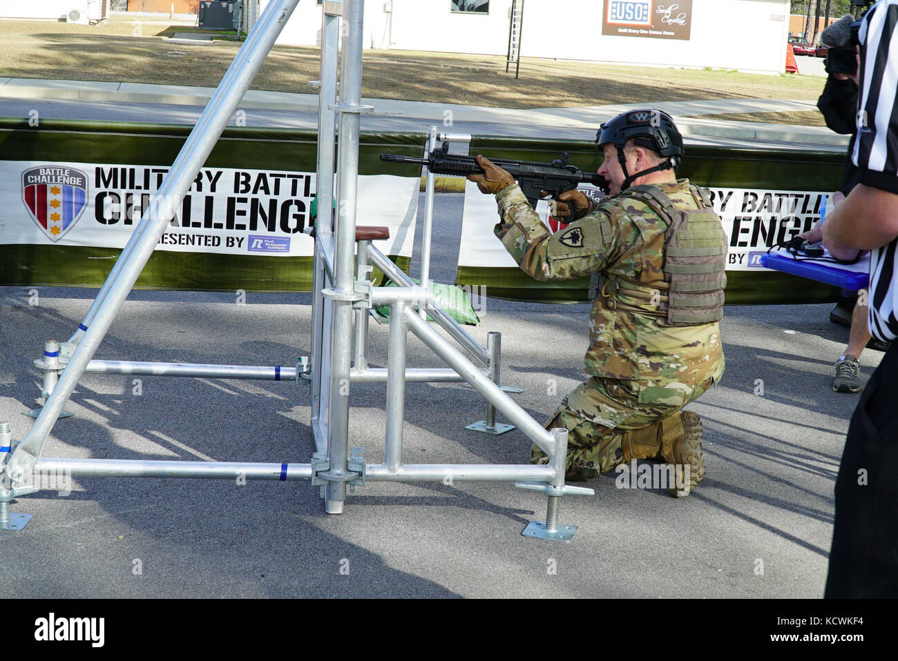 U.S. Army Maj. Gen. Robert E. Livingston, Jr., Adjutant General for South Carolina, competes in the “Battle Challenge” mobile obstacle course at McCrady Training Center in Eastover, South Carolina, Jan. 27, 2017. The Battle Challenge requires participants to perform nine tasks under pressure of time, including a cargo net climb, a knotted rope descent, wall surmount, ammunition resupply, low crawl, gas can carry, marksmanship tasks, and a service member-down rescue. (U.S. Army National Guard photo by Capt. Brian Hare) Stock Photo