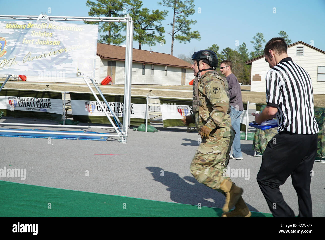 U.S. Army Maj. Gen. Robert E. Livingston, Jr., Adjutant General for South Carolina, competes in the “Battle Challenge” mobile obstacle course at McCrady Training Center in Eastover, South Carolina, Jan. 27, 2017. The Battle Challenge requires participants to perform nine tasks under pressure of time, including a cargo net climb, a knotted rope descent, wall surmount, ammunition resupply, low crawl, gas can carry, marksmanship tasks, and a service member-down rescue. (U.S. Army National Guard photo by Capt. Brian Hare) Stock Photo