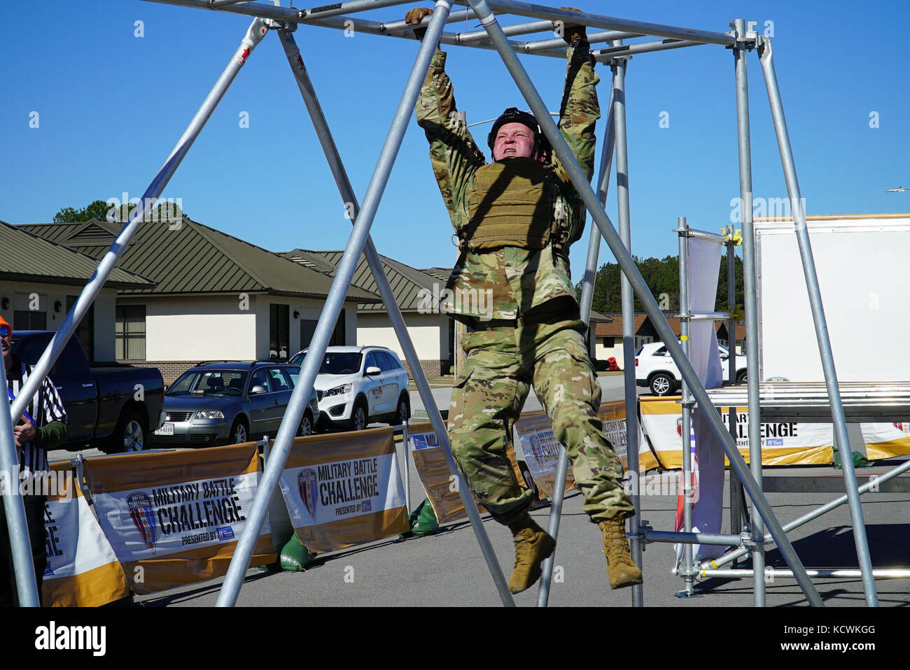 U.S. Army State Command Sgt. Maj. Russell A. Vickery, State Command Sgt. Maj., South Carolina National Guard, competes in the “Battle Challenge” mobile obstacle course at McCrady Training Center in Eastover, South Carolina, Jan. 28, 2017.  The Battle Challenge requires participants to perform nine tasks under pressure of time, including a cargo net climb, a knotted rope descent, wall surmount, ammunition resupply, low crawl, gas can carry, marksmanship tasks, and a service member-down rescue. (U.S. Army National Guard photo by Capt. Brian Hare) Stock Photo