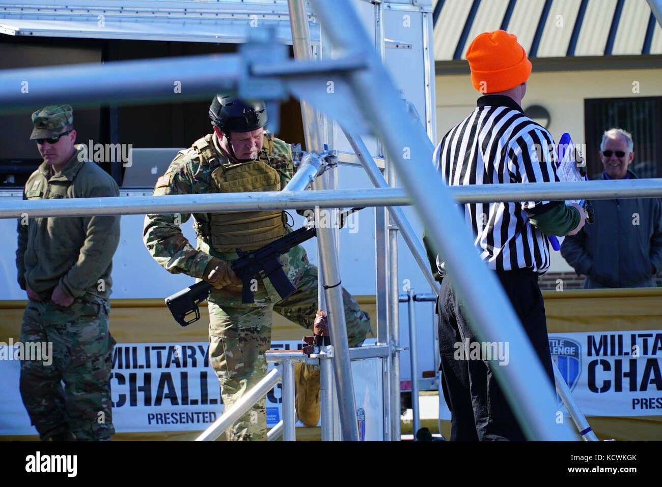 U.S. Army State Command Sgt. Maj. Russell A. Vickery, State Command Sgt. Maj., South Carolina National Guard, competes in the “Battle Challenge” mobile obstacle course at McCrady Training Center in Eastover, South Carolina, Jan. 28, 2017.  The Battle Challenge requires participants to perform nine tasks under pressure of time, including a cargo net climb, a knotted rope descent, wall surmount, ammunition resupply, low crawl, gas can carry, marksmanship tasks, and a service member-down rescue. (U.S. Army National Guard photo by Capt. Brian Hare) Stock Photo