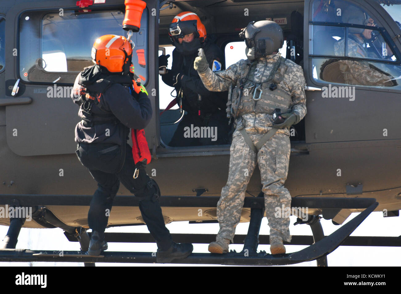 South Carolina National Guard Soldiers, and fire department/EMS rescuers with the S.C. Helicopter Aquatic Rescue Team (SC-HART) program, S.C. Urban Search and Rescue Task Force 1 (SC-TF1), perform hoist-training operations during the preliminary phases of âPatriot South Exercise 2017â (Patriot South 17), a joint training-exercise focused on natural disaster-response and preparedness, Gulfport and Port Bienville Industrial Complex (PBIC), Mississippi, Jan. 29, 2017. Patriot South 17 is taking place at multiple locations across Mississippi, from January 23 through February 7, 2017, and it offers Stock Photo