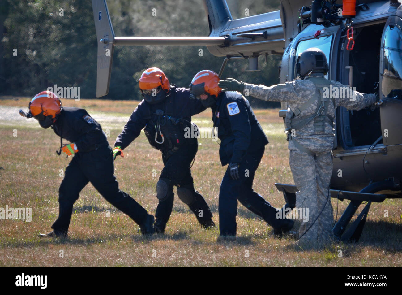 South Carolina National Guard Soldiers, and fire department/EMS rescuers with the S.C. Helicopter Aquatic Rescue Team (SC-HART) program, S.C. Urban Search and Rescue Task Force 1 (SC-TF1), perform hoist-training operations during the preliminary phases of “Patriot South Exercise 2017” (Patriot South 17), a joint training-exercise focused on natural disaster-response and preparedness, Gulfport and Port Bienville Industrial Complex (PBIC), Mississippi, Jan. 29, 2017. Patriot South 17 is taking place at multiple locations across Mississippi, from January 23 through February 7, 2017, and it offers Stock Photo