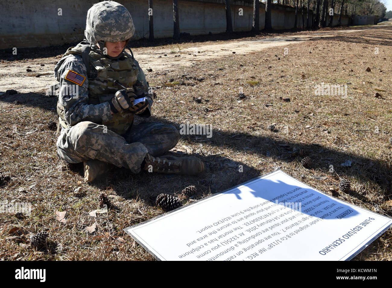 South Carolina Army National Guard Sgt. Rachel Clark, human resources non-commissioned officer with the 218th Leadership Regiment, completes a mystery challenge during the 2017 Best Warrior Competition at McCrady Training Center in Eastover, S.C., Jan 31, 2017. The Battle Challenge is a mobile obstacle course requiring participants to perform nine tasks under pressure of time, including a cargo net climb, a knotted rope descent, wall surmount, ammunition resupply, low crawl, gas can carry, marksmanship tasks, and a service member-down rescue. The event was open to all military service members, Stock Photo