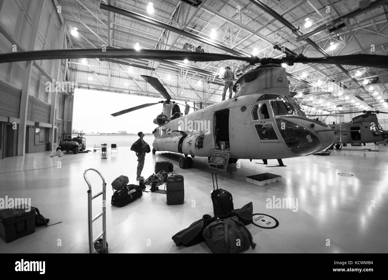 South Carolina National Guard Soldiers assigned to Detachment 1, Company B, 2-238th General Support Aviation Battalion, leave for a week-long training mission focused on high-altitude flight operations, aboard of a CH-47F Chinook heavy-lift cargo helicopter, Greenville, S.C., Feb. 24, 2017. The crew will attend a power management-centered course at the High-Altitude ARNG Aviation Training Site (HAATS), Eagle County, CO. (U.S. Army National Guard photo by Staff Sgt. Roberto Di Giovine) Stock Photo