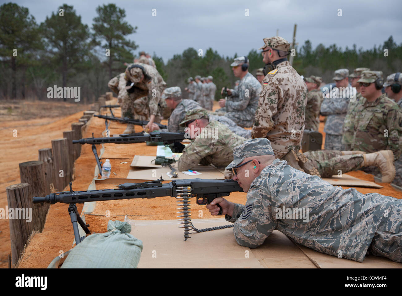 South Carolina National Guard Soldiers and Airmen participate in a live-fire German Proficiency Marksmanship Badge qualification at Fort Jackson, South Carolina with the assistance of Soldiers from the German Armed Forces Command, Mar. 8, 2017. The South Carolina National Guard service members utilized the German MG 3 machine gun, P8 pistol, and G36 assault rifle during the event. (U.S. Army National Guard photo by Capt. Brian Hare) Stock Photo
