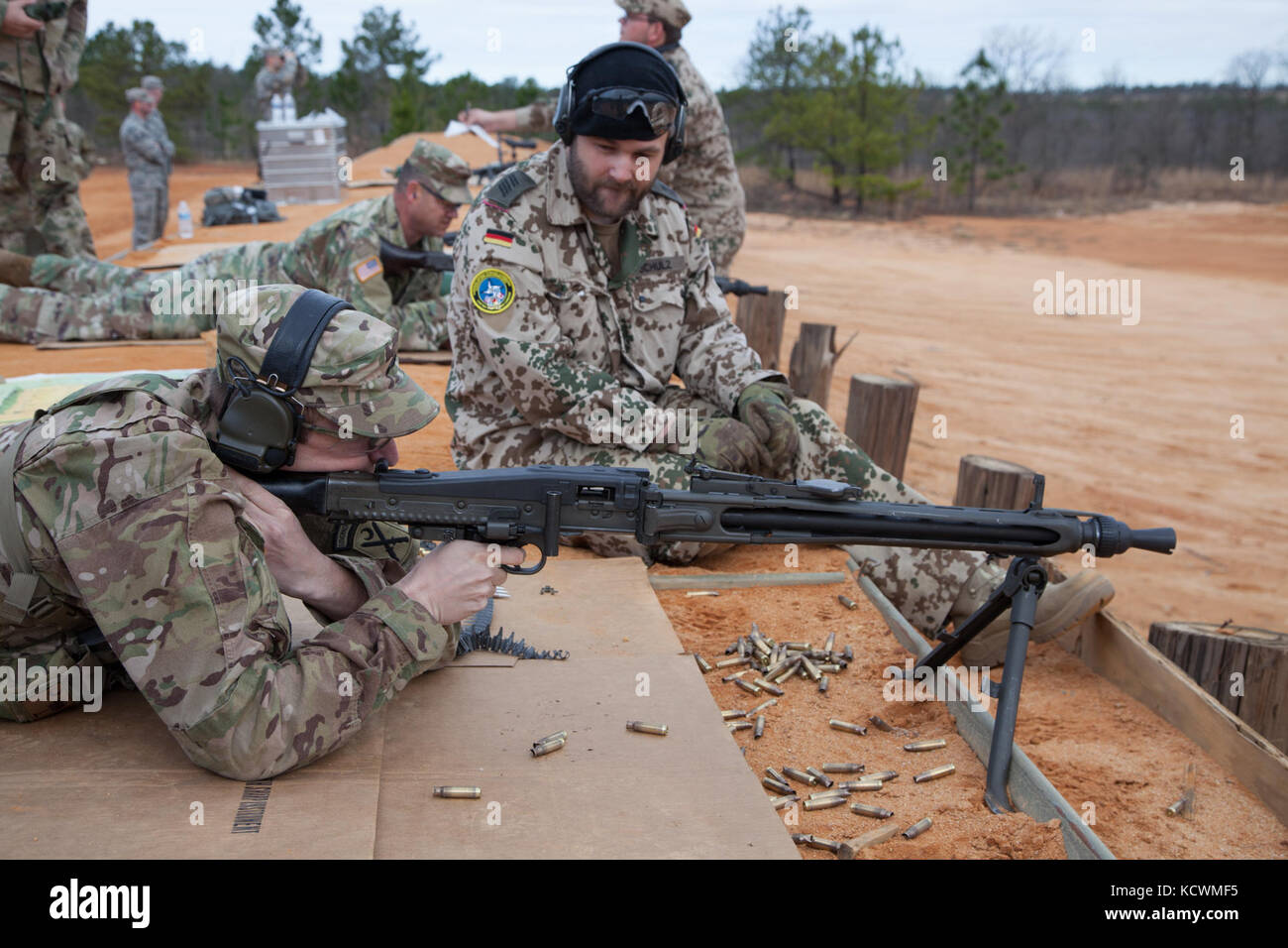 German Armed Forces Spc. Kai Schulz observes South Carolina National Guard Soldiers and Airmen participating in a live-fire German Proficiency Marksmanship Badge qualification at Fort Jackson, South Carolina with the assistance of Soldiers from the German Armed Forces Command, Mar. 8, 2017. The South Carolina National Guard service members utilized the German MG 3 machine gun, P8 pistol, and G36 assault rifle during the event. (U.S. Army National Guard photo by Capt. Brian Hare) Stock Photo