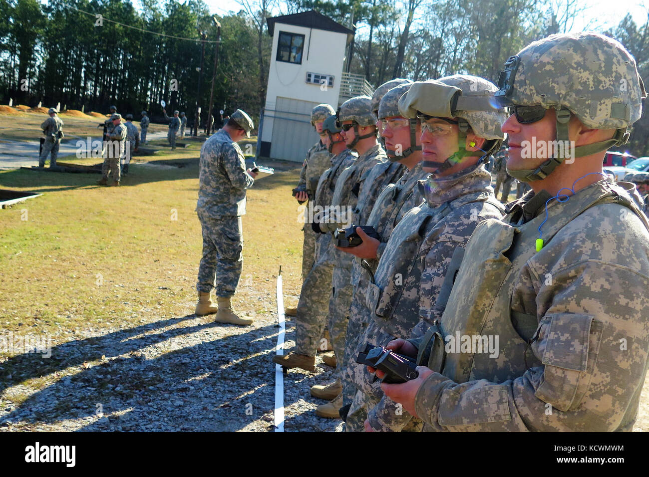 U.S. Soldiers assigned to  units in the Aviation Brigade, South Carolina Army National Guard, participate in M9 pistol marksmanship training during drill weekend at a firing range near the McCrady Training Center, Eastover, South Carolina, March 6, 2016.  Marksmanship training and weapons familiarization is a readiness requirement for the U.S. Army.  (U.S. Army National Guard photo by Lt. Col. Cindi King/ Released) Stock Photo