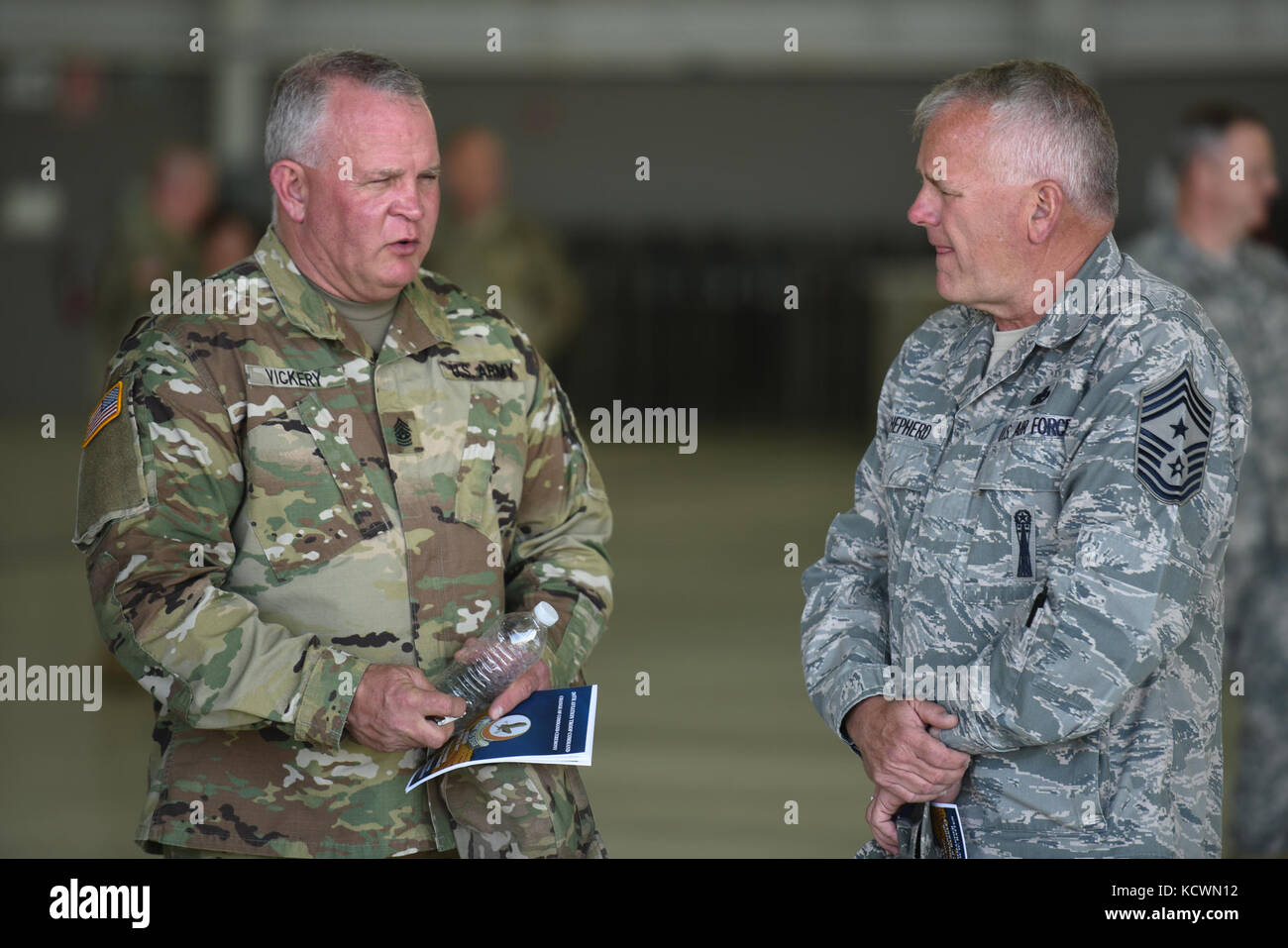 South Carolina Army National Guard Soldiers with 59th Aviation Troop Command participate in a change of command ceremony between outgoing brigade commander, Col. James Barkley, and incoming commander, Col. Andrew Batten, McEntire Joint National Guard Base, Eastover, S.C., Apr. 02, 2017. The purpose of the change of command ceremony is to pass the command of the unit to the new commander--the passing of responsibility over equipment and personnel. Furthermore, the passing of the unit colors emphasizes that “the organization is more important than the individual selected to lead it.” (U.S. Army  Stock Photo