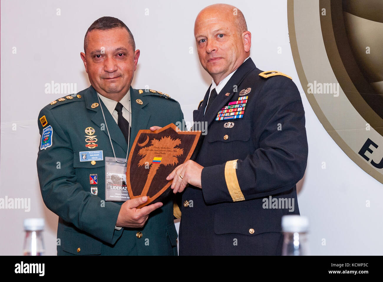 U.S. Army Maj. Gen. Robert E. Livingston, Jr., the adjutant general for South Carolina, presents Colombian Army Mayor General Juan Carlos Salazar with the palmetto shield as a token of appreciation at the Transformation Symposium, Bogota, Colombia, Aug. 5, 2016. (Photo by Sgt. Brian Calhoun, 108th Public Affairs Det.) Stock Photo