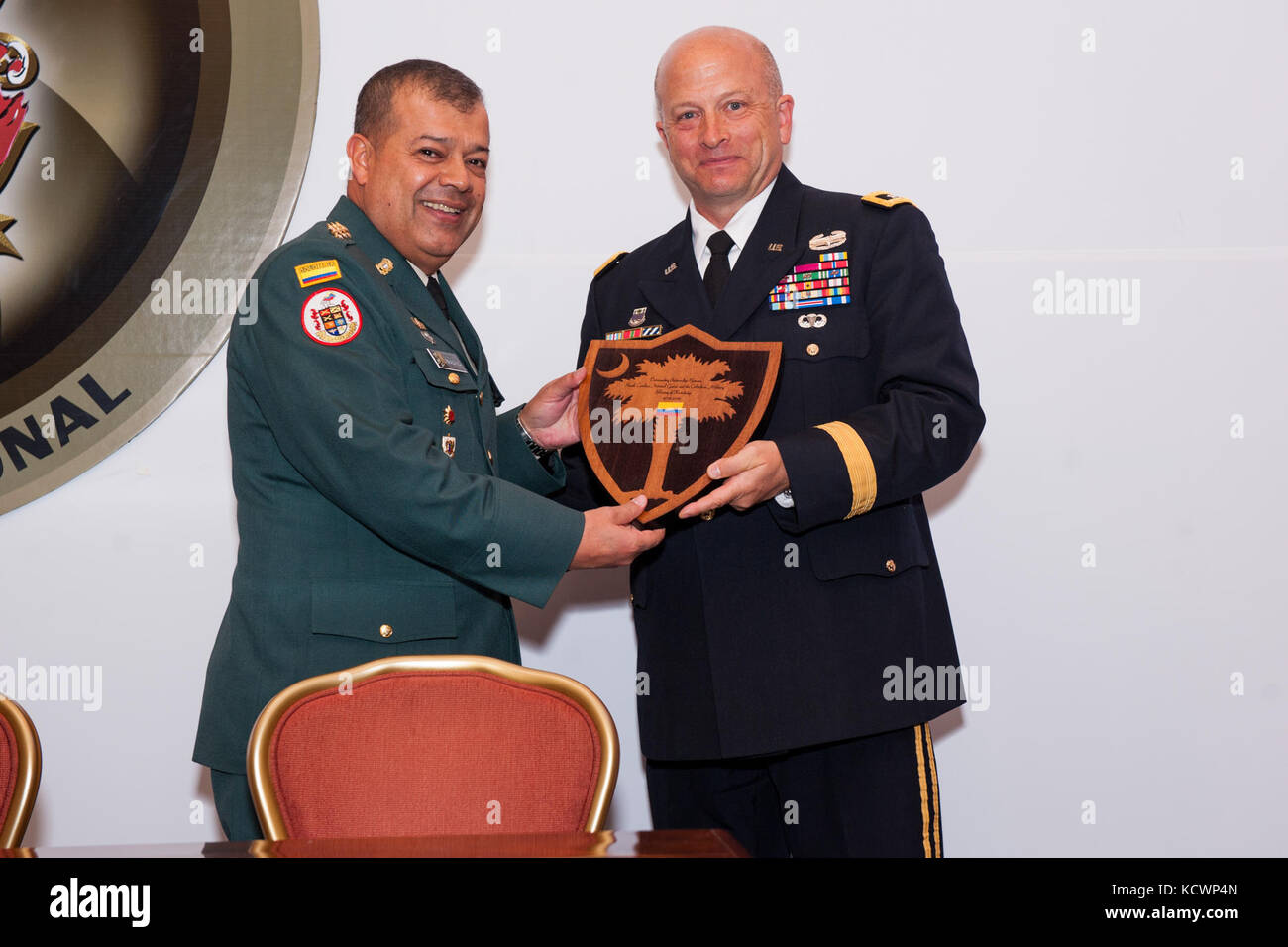 U.S. Army Maj. Gen. Robert E. Livingston, Jr., the adjutant general for South Carolina, presents the palmetto shield as a token of appreciation at the Transformation Symposium, Bogota, Colombia, Aug. 5, 2016. (Photo by Sgt. Brian Calhoun, 108th Public Affairs Det.) Stock Photo