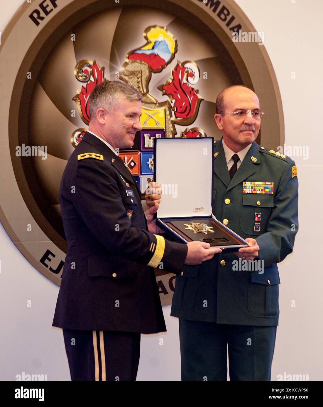 U.S. Army Maj. Gen. Robert Dyess, Deputy Director for the U.S. Army Capabilities Integration Center, receives a token of appreciation from the Colombian Army after speaking at the Transformation Symposium, Bogota, Colombia, Aug. 5, 2016. (Photo by Sgt. Brian Calhoun, 108th Public Affairs Det.) Stock Photo